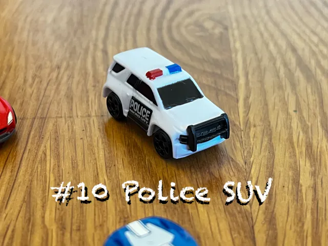 A carousel photo displaying the tenth vehicle named 'Police SUV' out of an array of 'Standard cars', at full size. The car/SUV is painted white with a 'Police Micro City' text printed on the right door.