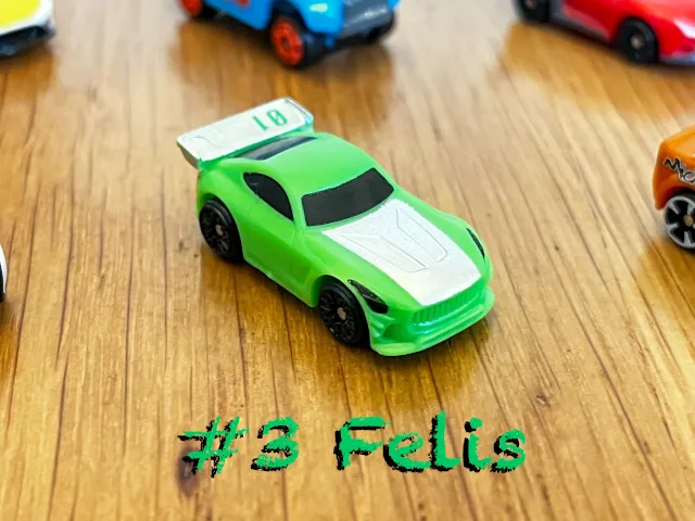 A carousel photo displaying the third vehicle named 'Felis' out of an array of 'Standard cars', at full size. The car is painted bright green with the white front painted.