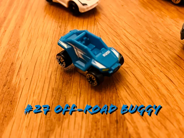 A carousel photo displaying the twenty-seventh vehicle named 'Off-Road Buggy' out of an array of 'Deluxe Cars', at full size. The buggy is painted mostly ocean blue, the following components white; front-lights and back-lights.