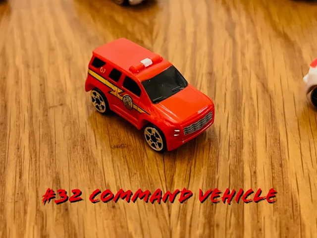 A carousel photo displaying the thirty-second vehicle named 'Command Vehicle' out of an array of 'Deluxe Cars', at full size. The larger car is painted red with the same strike of yellow lightning across the right door sides.