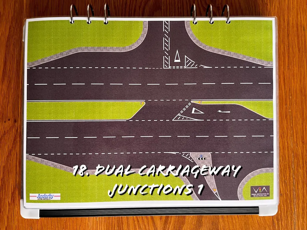 A carousel photo displaying the eighteen plan named 'dual carriageway junction 1' out of an array of roads layouts, at full size. Consisting of a double give-way lines, standard lanes and filter lanes.