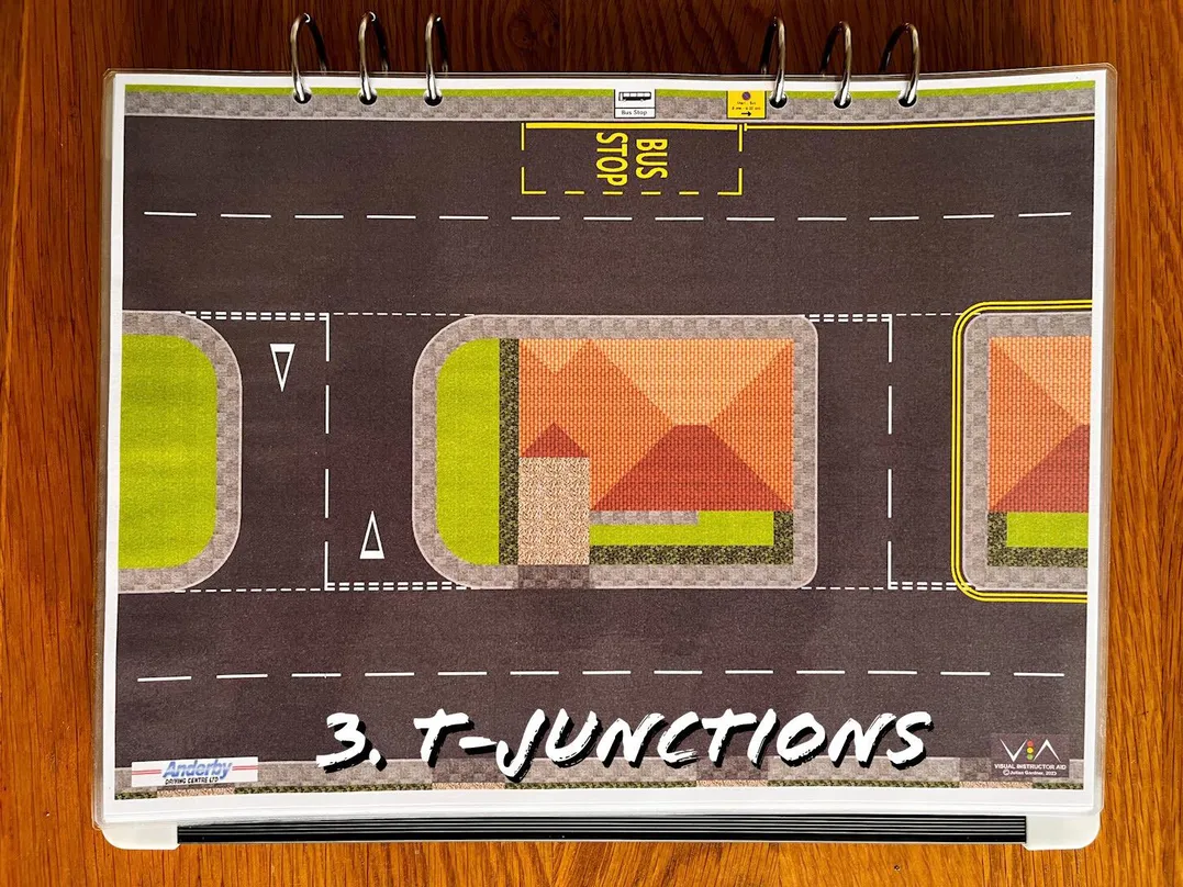 A carousel photo displaying the third plan named 't-junctions' out of an array of roads layouts, at full size. Consisting of two t-junctions; give-ways with give-way triangles and regular give-way lanes without the give-way triangles.