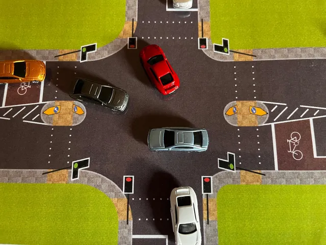 Using the same traffic light controlled crossroads road layout, cars are now driving towards their desired exits.