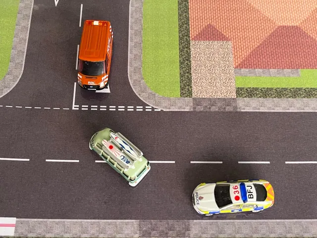 Utilizing the T-junctions road layout - a miniature van is demonstrated giving way to the green bus