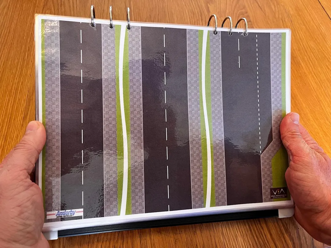 Seventh 'Compact & Convenient' carousel image with Julian showing off 'Straight Roads' V.I.A. kit road layout.