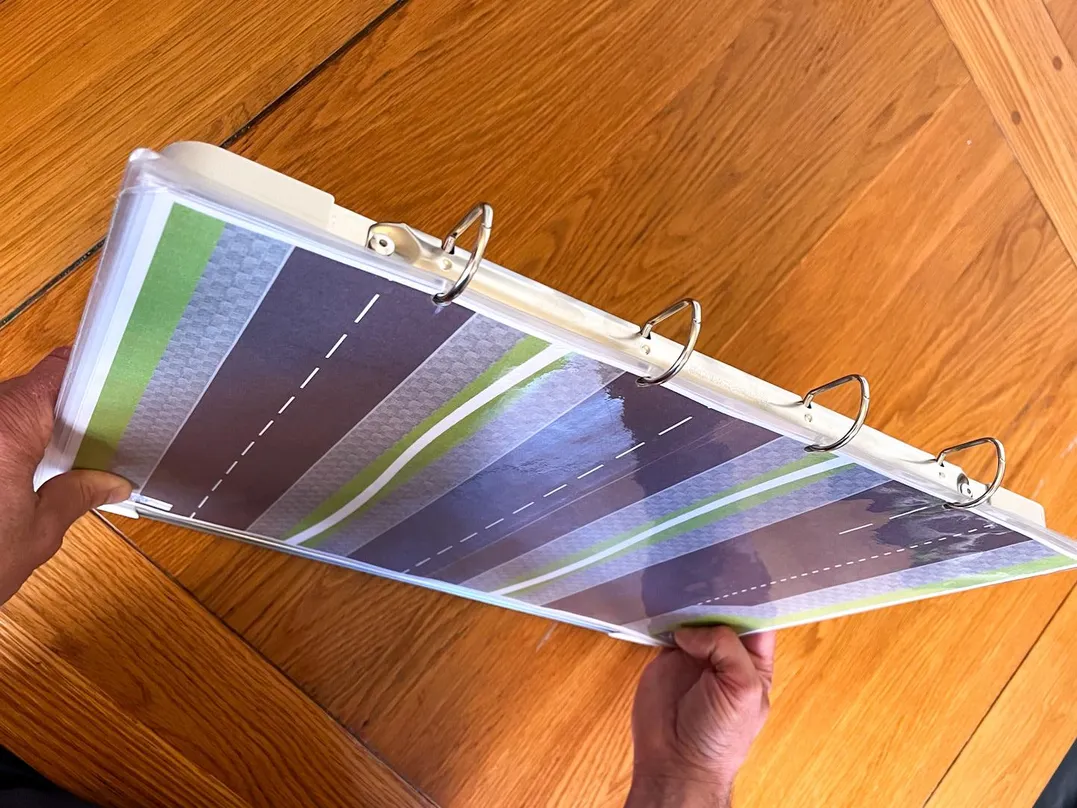 Fifth 'Compact & Convenient' carousel image consisting of Julian holding the V.I.A. kit sideways with both hands.